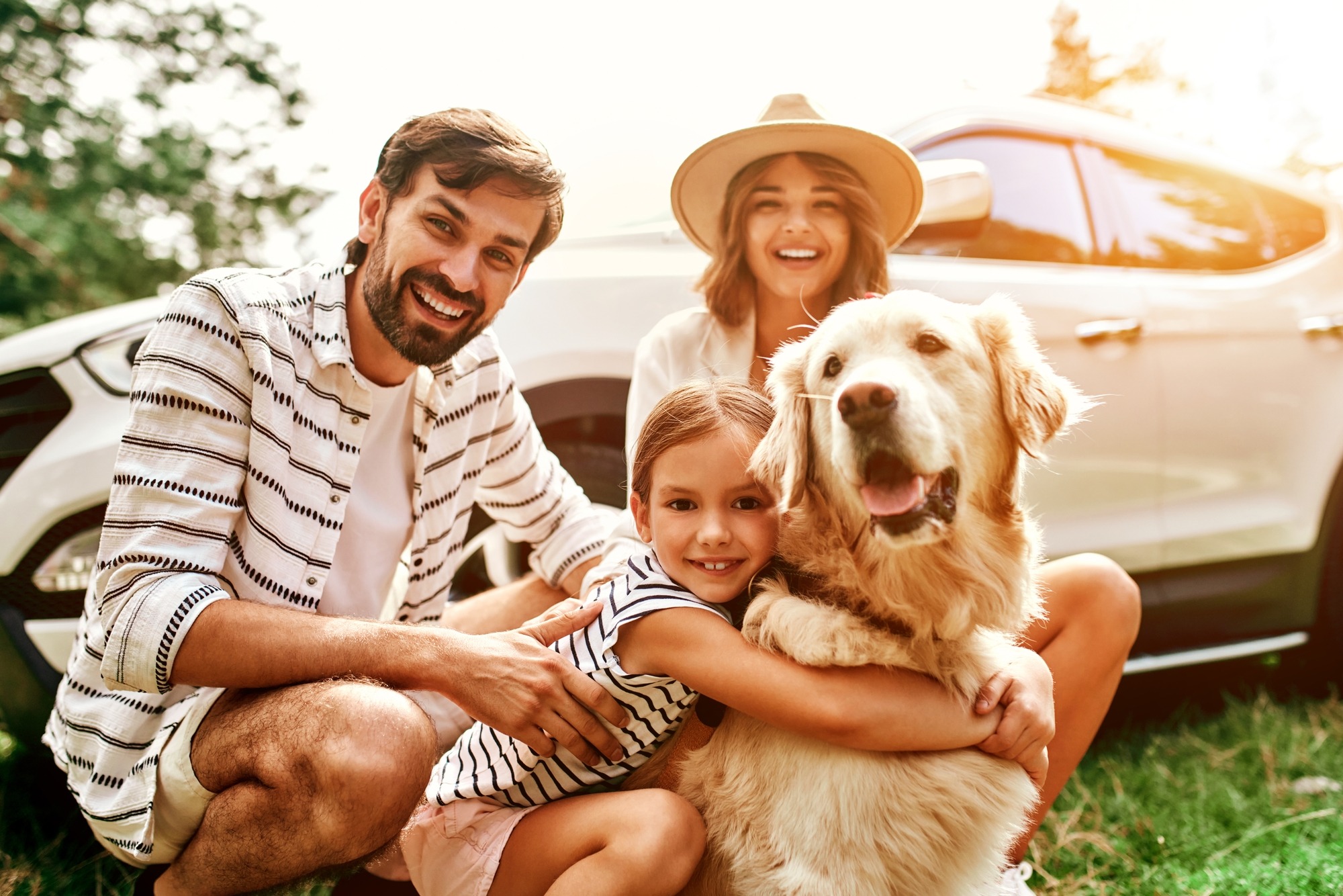 The whole family came to nature for the weekend. Mom and Dad with their daughter and a Labrador dog